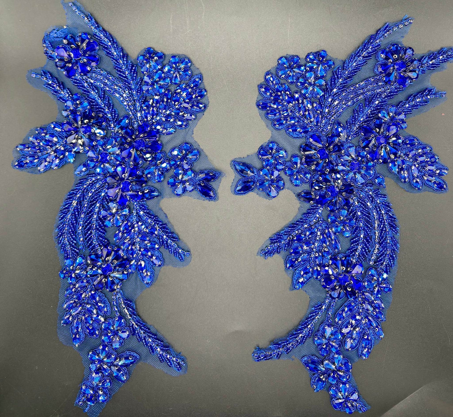 Handmade rhinestone applique pair in blue, intricately designed for elegant accents.