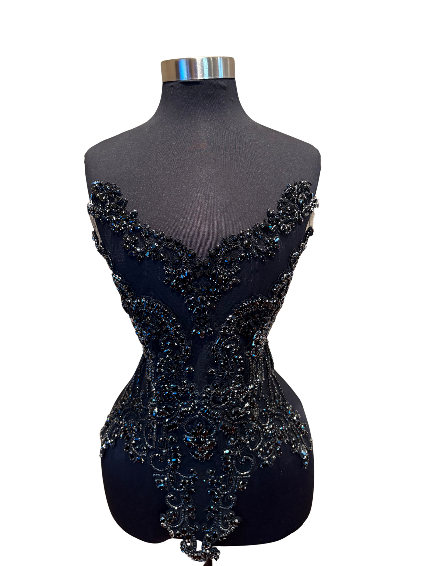 Black Handmade rhinestone bodice appliqué with intricate beadwork on black mannequin.