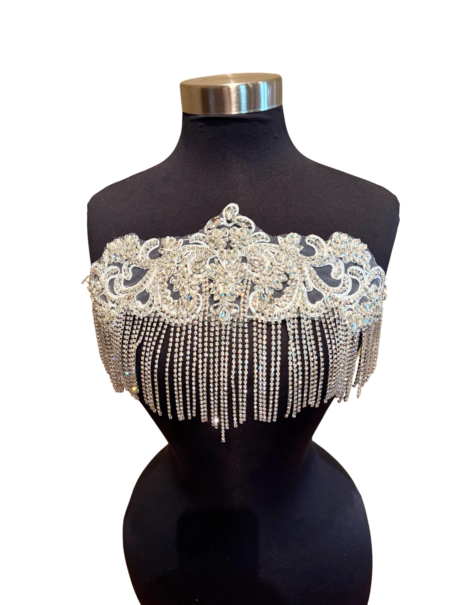 Handmade rhinestone fringe applique on mannequin, elegant design with chain fringe.