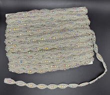 Rhinestone and beaded yardage with oval design in AB/Silver.