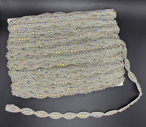 Rhinestone and beaded yardage with oval design in AB/Silver.