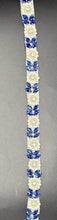 Natalie's Yardage with Pearls featuring blue rhinestones and pearls on fabric.