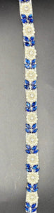 Natalie's Yardage with Pearls featuring blue rhinestones and pearls on fabric.