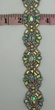 Extravagant rhinestone yardage with 1 3/8" width featuring iridescent AB rhinestones.