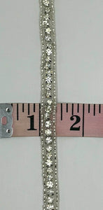 Beaded and rhinestone yardage trim, approximately 3/8 inch wide, displayed beside a measuring tape.