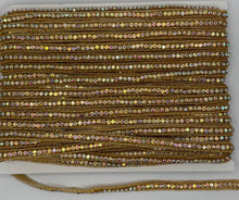 Handmade beaded and rhinestone yardage, approximately 3/8" wide.