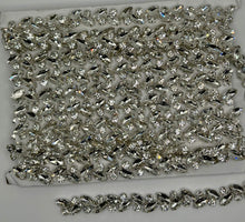 Rhinestone chain yardage with sparkling rhinestones approx. 1/4" wide for versatile embellishments.