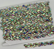 Rhinestone chain yardage with colorful sparkling stones on a card, approx. 1/4" wide.