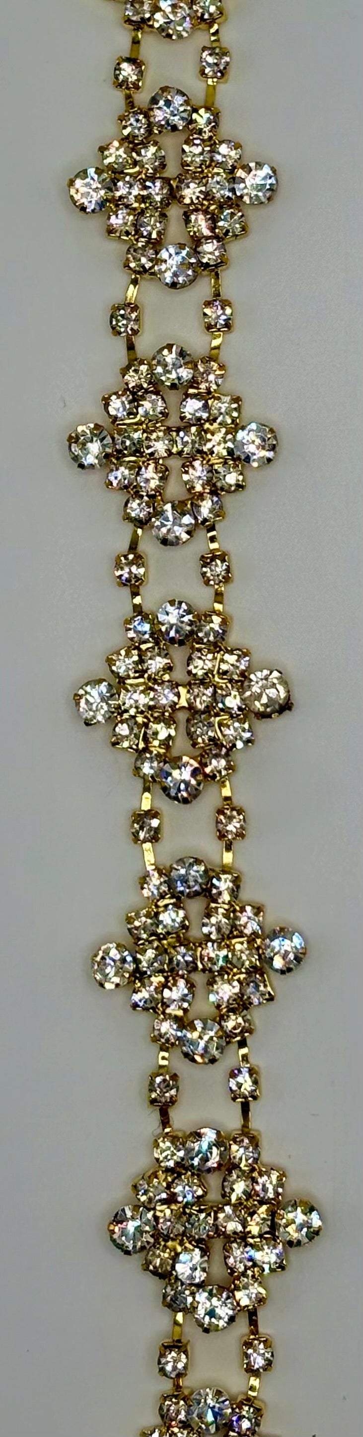 Tiny rhinestone cluster yardage, clear rhinestones on gold, 1-inch width.