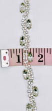 "Allison" Rhinestone Yardage with clear rhinestones on silver trim measuring approximately 3/8 inch wide.