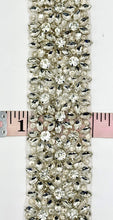 Ariel Rhinestone trim with silver setting and intricate design, 2 inches wide.
