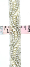 Elegant handmade pearl and rhinestone yardage trim, approximately 1 inch wide, showcasing a swirl pattern.