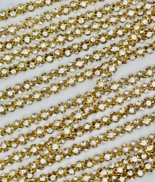 Metal rhinestone rope, 4MM, clear rhinestones on gold background.