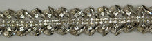 Handmade clear rhinestone bridal belt on silver background.