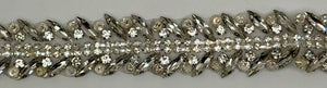 Handmade clear rhinestone bridal belt on silver background.