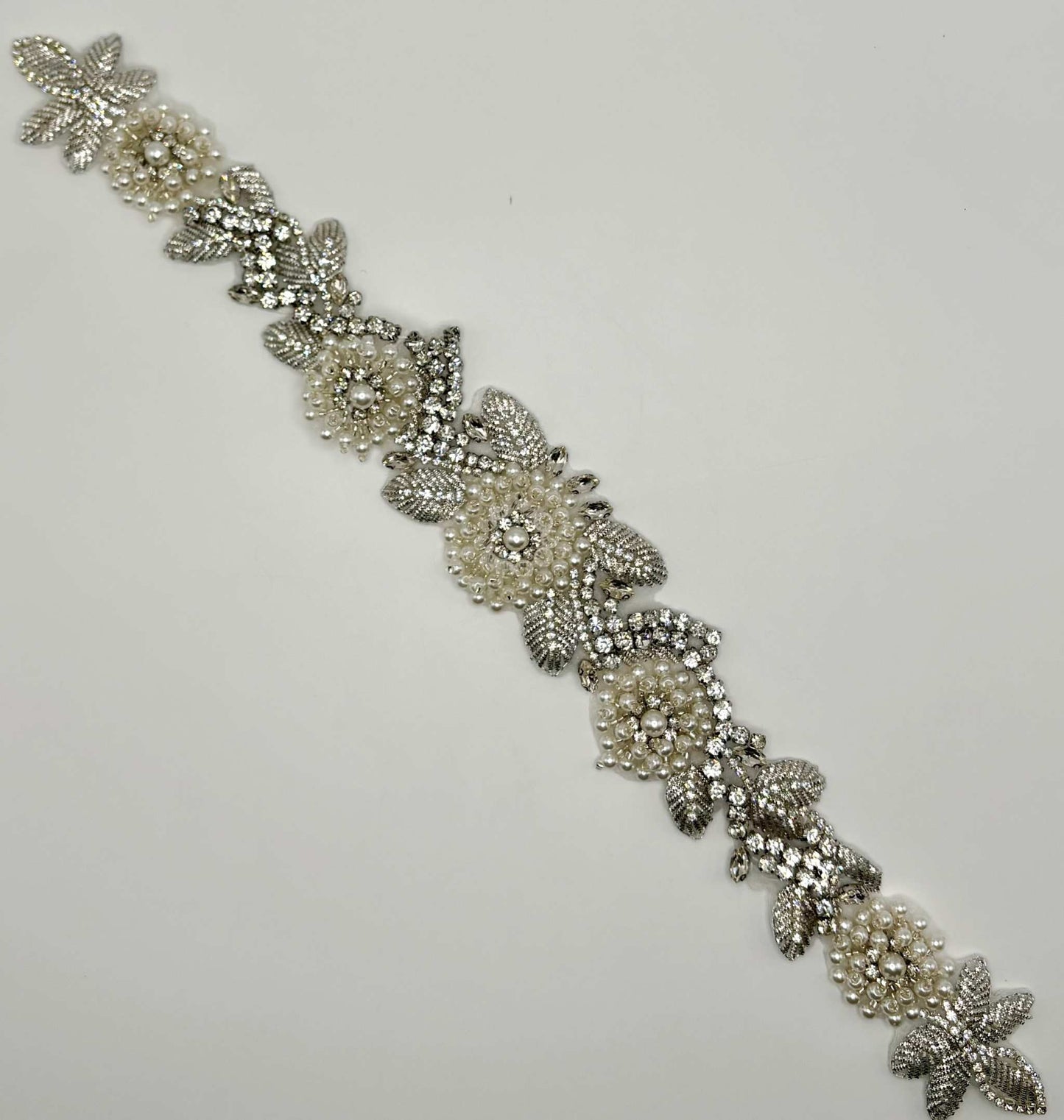 Rhinestone and pearls bridal belt with intricate handmade appliqué design.