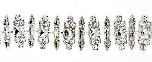 Rhinestone chain yardage with sparkling rhinestones on flexible chain, 1 inch wide.
