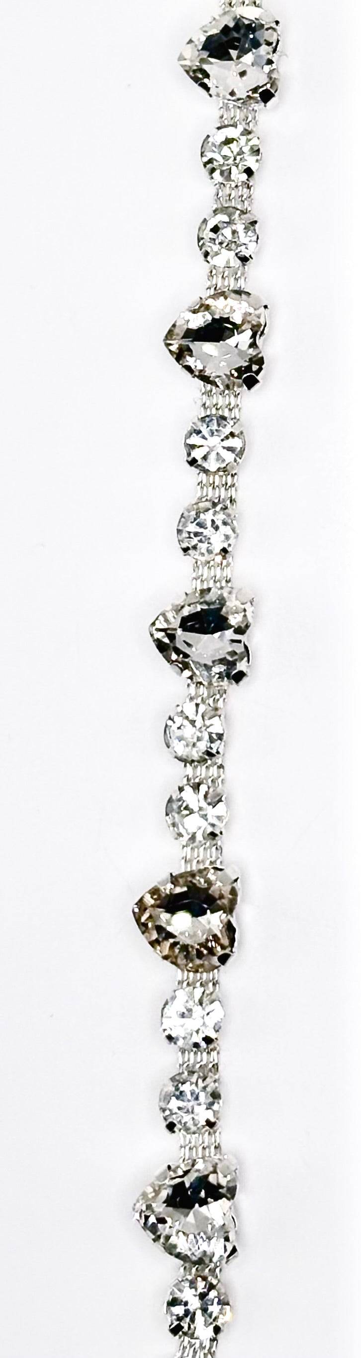 Clear round and heart rhinestones on silver chain.