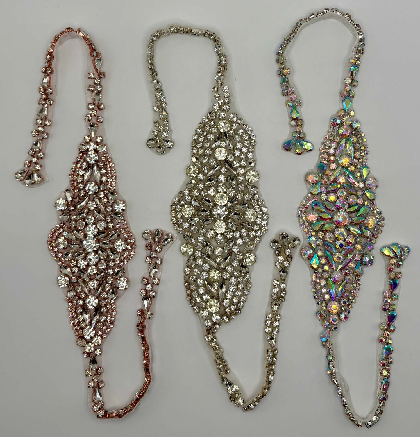 Simply Stunning handmade rhinestone bridal belts in varied styles.