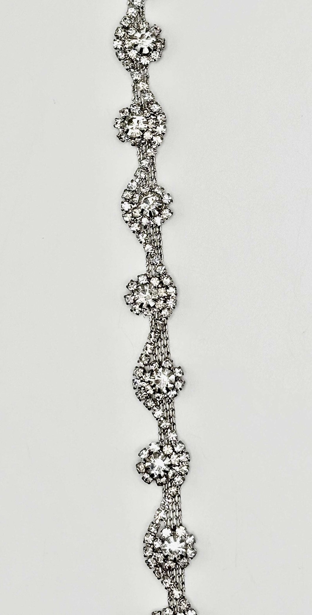 Skylar handmade rhinestone chain yardage with intricate design.