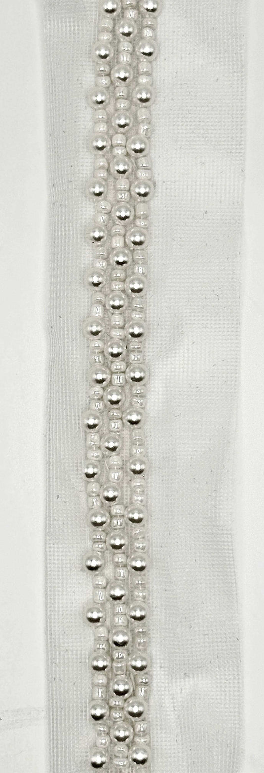 Handmade Pearl Trim – 1/4" Wide on White Lace, featuring lustrous pearls on soft white lace.